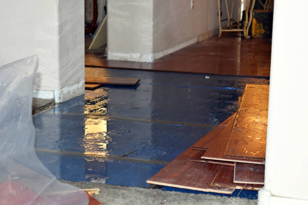 Professional Flood Damage Restoration technician working in Amesville, OH